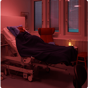 A pregnant woman lying in a hospital bed